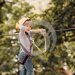 Artworks depict games at eco resort which includes flying fox or spider net. Toddler kindergarten. Happy child boy