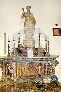 Artworks inside the cathedral of San Nicola di Bari in Taormina. Statue, marble