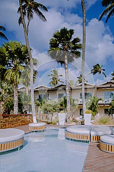Aruba Caribbean Hammock on the beach with palm trees and luxury swimming pool