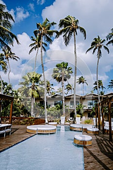 Aruba Caribbean Hammock on the beach with palm trees and luxury swimming pool