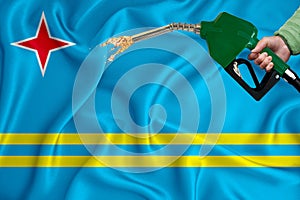 ARUBA flag Close-up shot on waving background texture with Fuel pump nozzle in hand. The concept of design solutions. 3d rendering