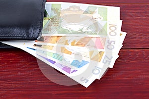 Aruban Florin in the black wallet