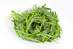 Arugula fresh heap leaf on white background