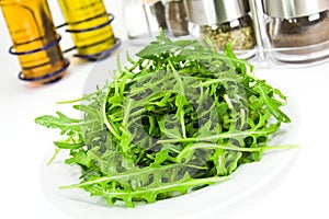 Arugula fresh heap leaf on white background