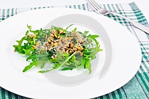 Arugula Salad with Germinated Grain in White Plate