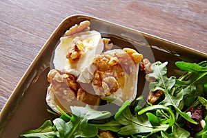 Arugula salad with goat cheese honey and nuts