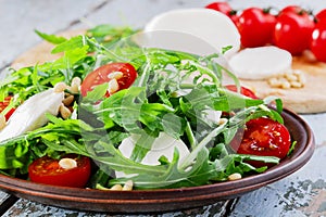 Arugula salad with mozzarella photo