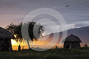 Arusha, Tanzania on 1st June 2019. Family with masai walking at sunrise at there house