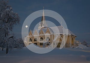 Arvidsjaur church with moon. Winter in Lapland, Sweden, Norrbotten