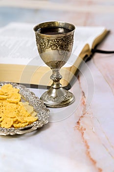 As a Christian, Holy Communion is celebrated with unleavened bread, wine in a chalice, and other symbols of Jesus Christ