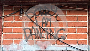 As graffiti written sorry i am dancing on a wall