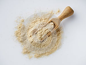 Asafoetida aromatic powder on a white acrylic background