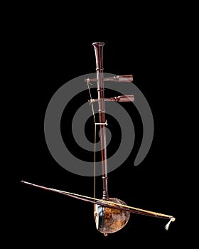 Asain musical instrument ,fiddle , black background