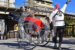 Asakusa rickshaw with a tourist and the puller