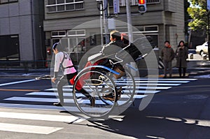 Asakusa rickshaw with a tourist and the puller