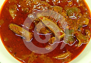 Asam Pedas, the signature dish of Malacca State of Malaysia. Spicy,hot and sour curry usually served with fish and White Rice. photo