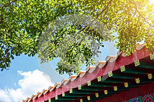 Chinese roof style building with green tree clean air fresh blue sky. china eco sustainable city concept