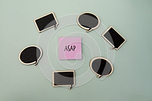 ASAP written on a note surrounded by speech bubbles