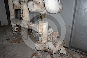 Asbestos pipe insulation in a mechanical room photo