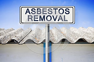 Asbestos removal concept image with text written on a placard photo