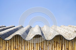 Asbestos roof above a wattle wall - image with copy space