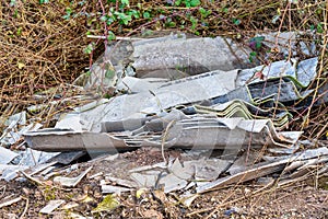 Asbestos sheets which have been dumped