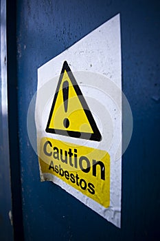 Asbestos warning sign on building