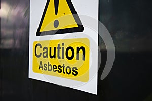 Asbestos warning sign on building