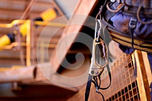 Ascender hanging on rope access technician harness chair photo