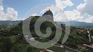 Ascending aerial drone view of La Piedra del PeÃ±ol in Colombia