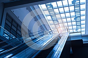 Ascending escalator in a public transport