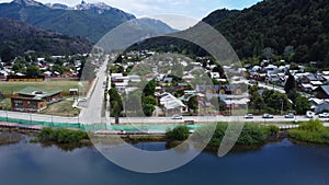 Ascending motion above a lake revealing the town of Futaleufu, Chile