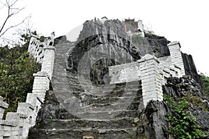 Ascending stone staircase to Hang Mua pagoda, Ninh Binh, Vietnam photo