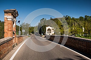 ASCIANO, TUSCANY, Italy - the Garbo bridge over the Ombrone rive photo