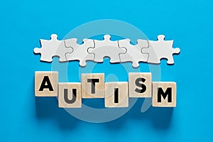 ASD or autism spectrum disorder. The word autism on wooden cubes