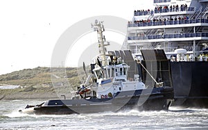 An asd powered tugboat assisting a ferry