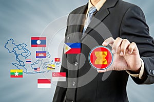 ASEAN Economic Community in businessman hand