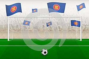 ASEAN football team fans with flags of ASEAN cheering on stadium, penalty kick concept in a soccer match