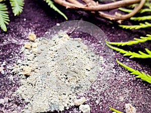 Ash pile with purple colour background. Lent Season, Holy Week, Ash Wednesday, Palm Sunday and Good Friday concepts.