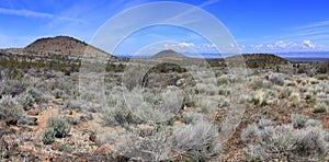 Landscape Panorama of Cinder Cones and Sagebrush Plains, Lava Beds National Monument, Northern California, USA photo