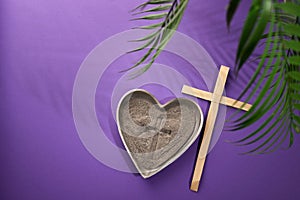 Ash Wednesday, Lent Season and Holy Week concept. Christian crosses and ashes on purple background.