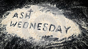 ASH WEDNESDAY text written on white sand