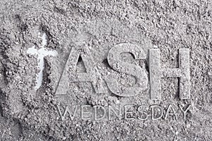 Ash wednesday word written in ash and christian cross symbol as a religion concept