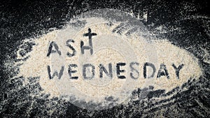 ASH WEDNESDAY word written on white sand