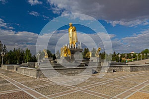 ASHGABAT, TURKMENISTAN - APRIL 17, 2018: Saparmurat Niyazov golden statue in Ashgabat, Turkmenist