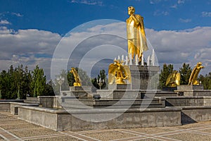 ASHGABAT, TURKMENISTAN - APRIL 17, 2018: Saparmurat Niyazov golden statue in Ashgabat, Turkmenist