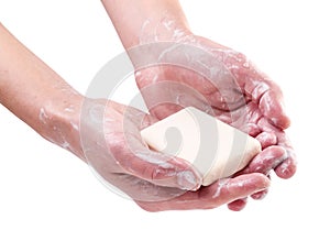 Ashing hands with soap on a white background. Isolated photo