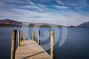 Ashness Pier Jetty At Derwentwater Lake In Cumbria On A Sunny Afternoon.