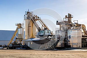 Ashphalt plant sits idle waiting for workers. Calgary Alberta Canada