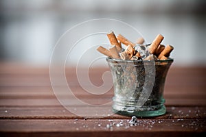 Ashtray full with butts photo